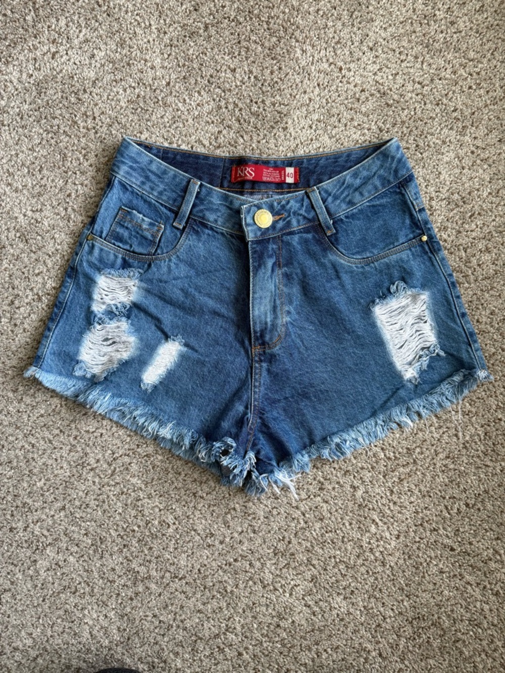 High-Rise Distressed Denim Shorts in Dark Blue